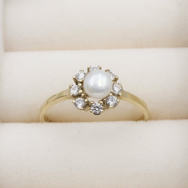 Anillo con perla y zirconias 10k